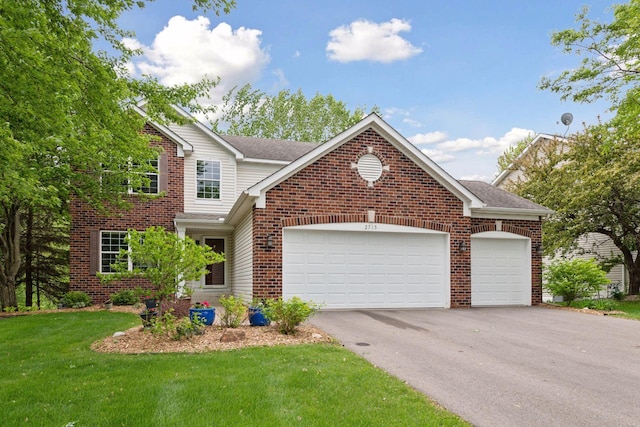 2715 Autumn Woods Dr, Chaska, MN 55318 - traditional-style home with asphalt driveway, a garage, brick siding, roof with shingles, and a front yard