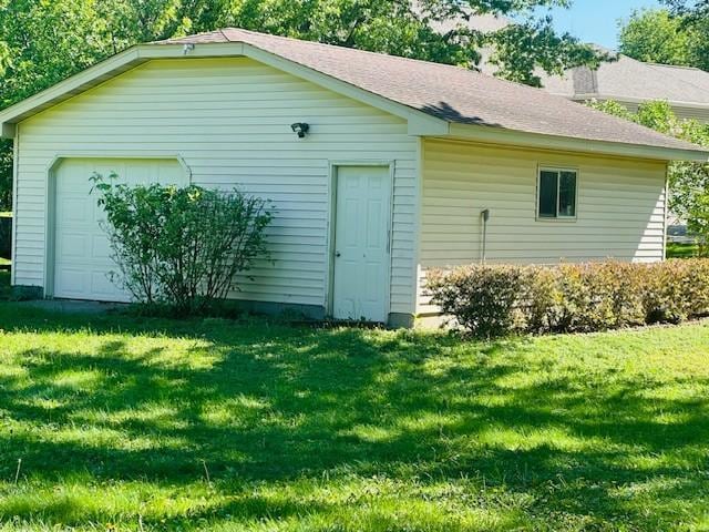 14717 Able St NE, Ham Lake, MN 55304 - view of property exterior with a garage, a yard, and an outdoor structure