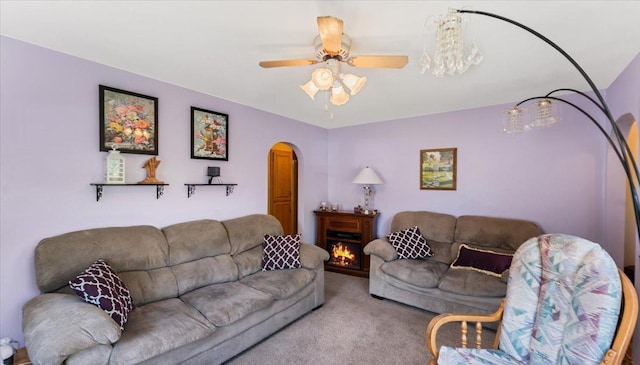335 Cossairt Ave W, Eden Valley, MN 55329 - carpeted living area featuring arched walkways and a ceiling fan