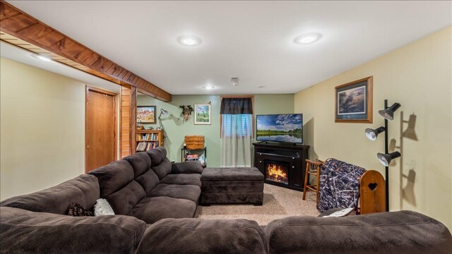 335 Cossairt Ave W, Eden Valley, MN 55329 - carpeted living area featuring a lit fireplace and recessed lighting