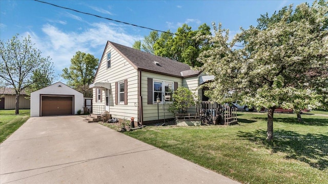 335 Cossairt Ave W, Eden Valley, MN 55329 - view of front of house featuring an outbuilding, a detached garage, a front yard, and concrete driveway