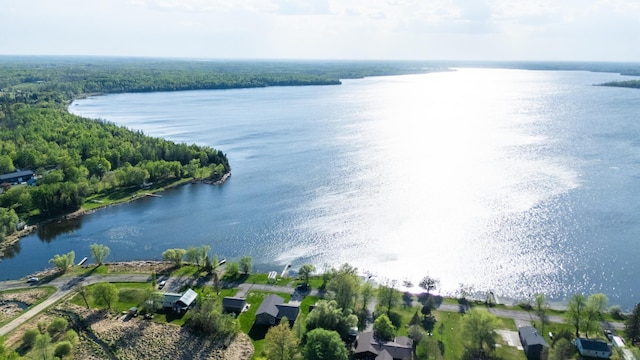 aerial view of property and surrounding area with a nearby body of water