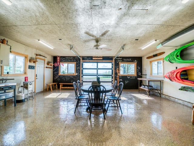 dining area with plenty of natural light and ceiling fan