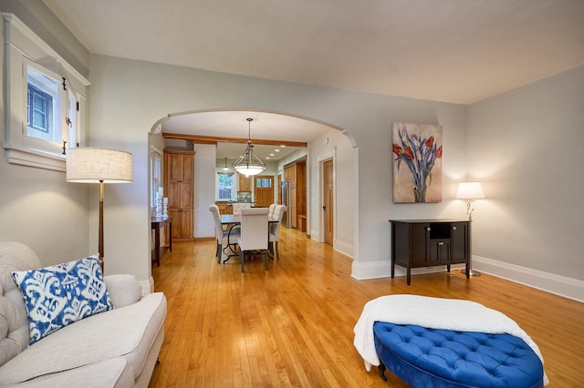 4448 Aldrich Ave S, Minneapolis, MN 55419 - living room featuring arched walkways and light wood-type flooring
