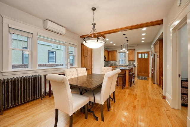 4448 Aldrich Ave S, Minneapolis, MN 55419 - dining room featuring radiator heating unit, a wall mounted air conditioner, plenty of natural light, light wood-style flooring, and recessed lighting