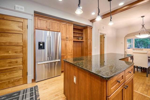 4448 Aldrich Ave S, Minneapolis, MN 55419 - kitchen featuring stainless steel fridge, brown cabinets, light wood-type flooring, a center island, and beam ceiling