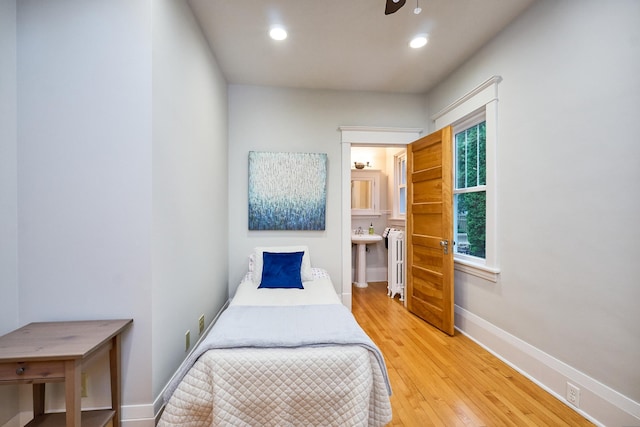 4448 Aldrich Ave S, Minneapolis, MN 55419 - bedroom with radiator, wood finished floors, and recessed lighting