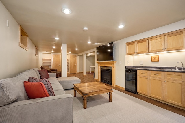 4448 Aldrich Ave S, Minneapolis, MN 55419 - living room with beverage cooler, bar with sink, light wood finished floors, recessed lighting, and built in features