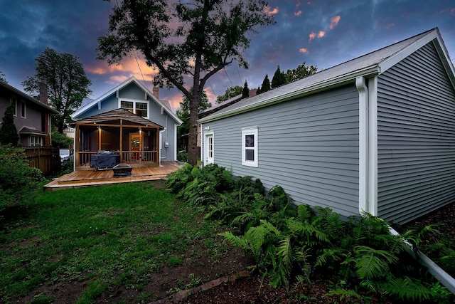 4448 Aldrich Ave S, Minneapolis, MN 55419 - back of property at dusk with a deck and a yard