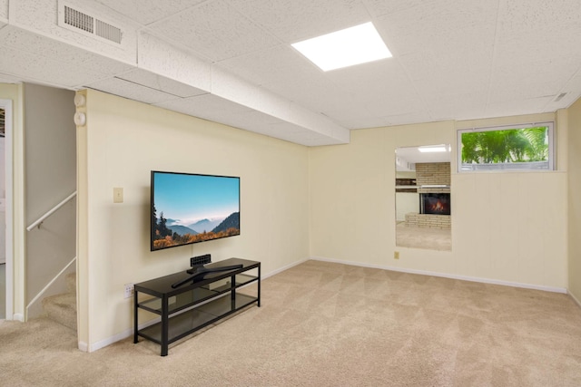 2479 Oxford St N, Roseville, MN 55113 - carpeted living room with a fireplace, stairway, and baseboards