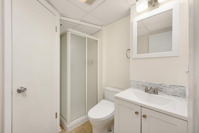 2479 Oxford St N, Roseville, MN 55113 - full bathroom with a paneled ceiling, a shower stall, toilet, and vanity