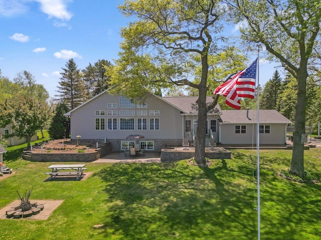 1823 313th Ave NE, Isanti Twp, MN 55008 - rear view of house with a patio and a lawn