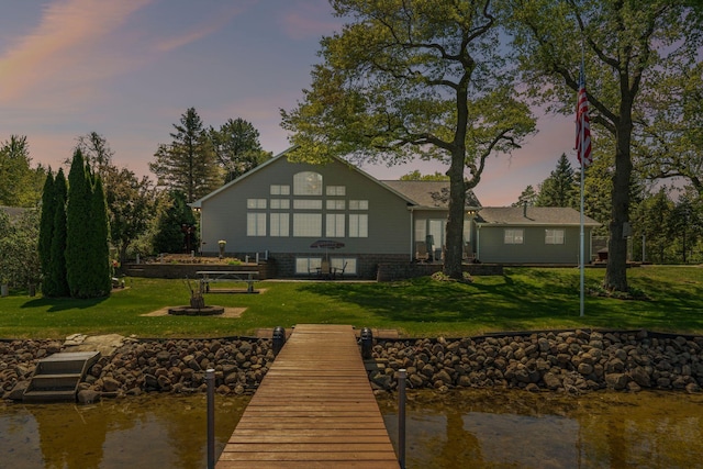1823 313th Ave NE, Isanti Twp, MN 55008 - rear view of property featuring a lawn and a water view