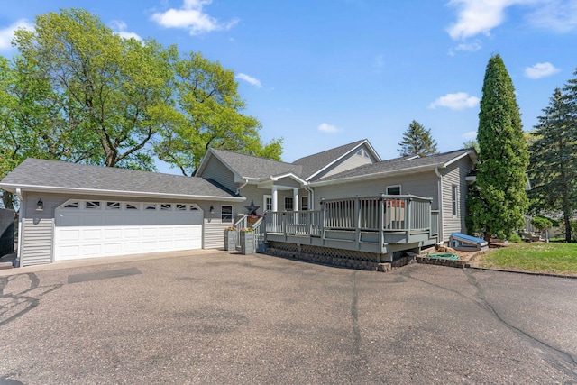 1823 313th Ave NE, Isanti Twp, MN 55008 - view of front facade featuring a garage, asphalt driveway, and a shingled roof