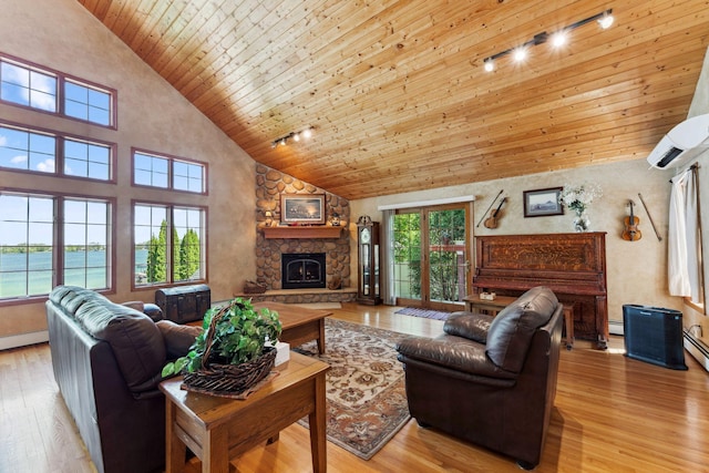 1823 313th Ave NE, Isanti Twp, MN 55008 - living room with high vaulted ceiling, wood ceiling, a fireplace, light wood-type flooring, and a wall mounted air conditioner
