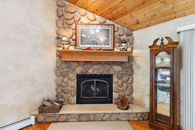 1823 313th Ave NE, Isanti Twp, MN 55008 - detailed view of baseboard heating, wood finished floors, a fireplace, and wood ceiling