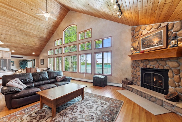 1823 313th Ave NE, Isanti Twp, MN 55008 - living area featuring wooden ceiling, baseboard heating, high vaulted ceiling, plenty of natural light, and ceiling fan