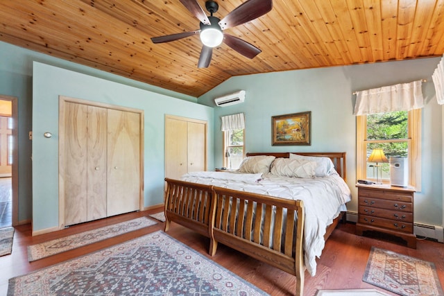 1823 313th Ave NE, Isanti Twp, MN 55008 - bedroom featuring a wall mounted air conditioner, multiple windows, two closets, lofted ceiling, and wood finished floors