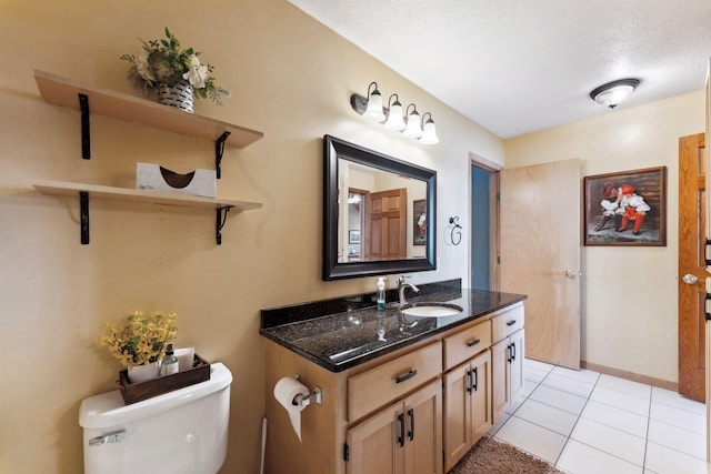 1823 313th Ave NE, Isanti Twp, MN 55008 - bathroom featuring toilet, vanity, tile patterned flooring, and a textured ceiling