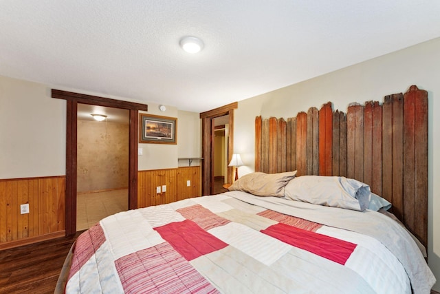 1823 313th Ave NE, Isanti Twp, MN 55008 - bedroom featuring wood finished floors, wainscoting, and wood walls
