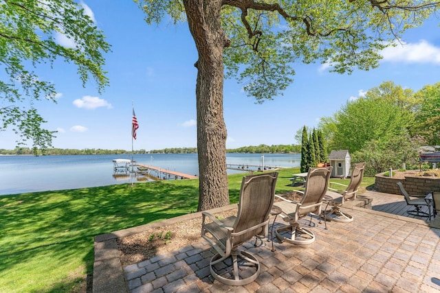 1823 313th Ave NE, Isanti Twp, MN 55008 - view of patio / terrace with a dock, a water view, and boat lift