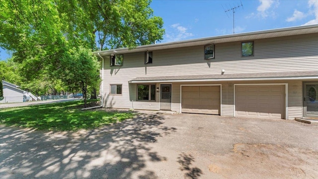 305 Arcadian Pl Unit 1, Buffalo, MN 55313 - view of front of home featuring an attached garage and driveway