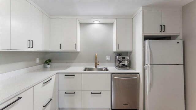 305 Arcadian Pl Unit 1, Buffalo, MN 55313 - kitchen with freestanding refrigerator, dishwasher, a sink, and light countertops