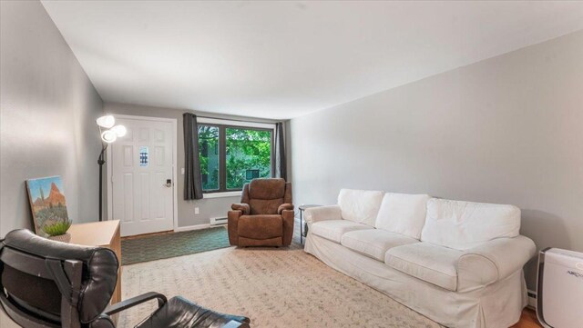 305 Arcadian Pl Unit 1, Buffalo, MN 55313 - carpeted living room featuring a baseboard radiator and baseboards
