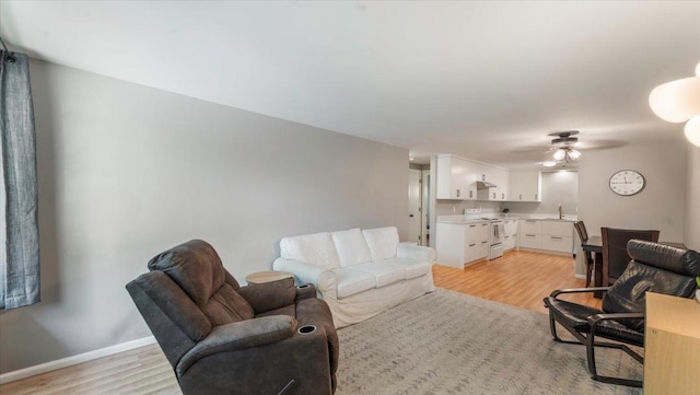 305 Arcadian Pl Unit 1, Buffalo, MN 55313 - living room featuring light wood-type flooring, ceiling fan, and baseboards
