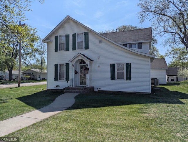 532 Main St S, Sauk Centre, MN 56378 - traditional-style home featuring a front lawn, central AC, and roof with shingles