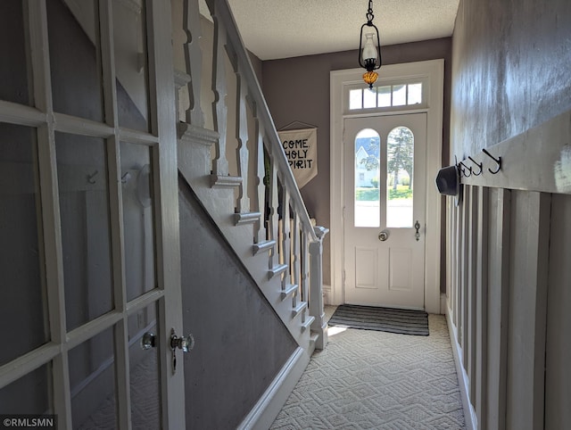532 Main St S, Sauk Centre, MN 56378 - carpeted foyer featuring a textured ceiling and stairs