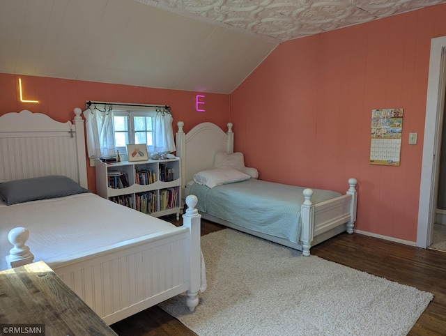 532 Main St S, Sauk Centre, MN 56378 - bedroom featuring wood finished floors, vaulted ceiling, and baseboards