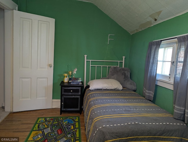 532 Main St S, Sauk Centre, MN 56378 - bedroom featuring wood finished floors and lofted ceiling