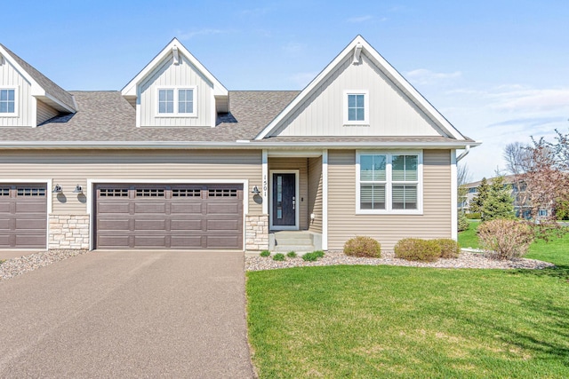 1501 Southpoint Dr, Hudson, WI 54016 - view of front facade featuring a front yard, driveway, an attached garage, and a shingled roof