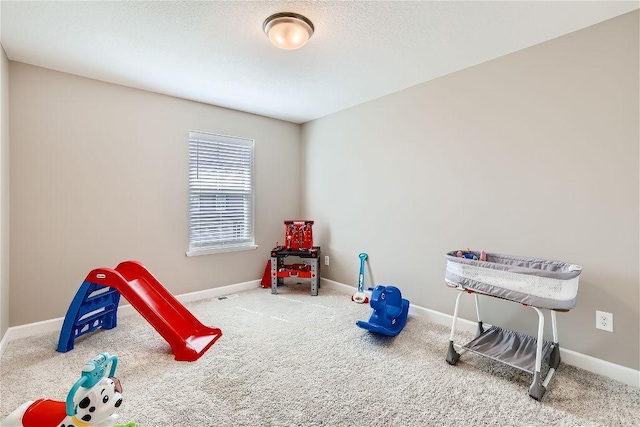 game room featuring carpet floors and baseboards