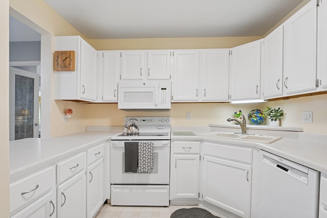 2250 Ridge Dr Unit 11, Saint Louis Park, MN 55416 - kitchen with white appliances, a sink, light countertops, and white cabinetry