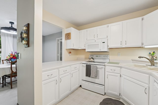 2250 Ridge Dr Unit 11, Saint Louis Park, MN 55416 - kitchen featuring white appliances, a sink, light countertops, and white cabinetry