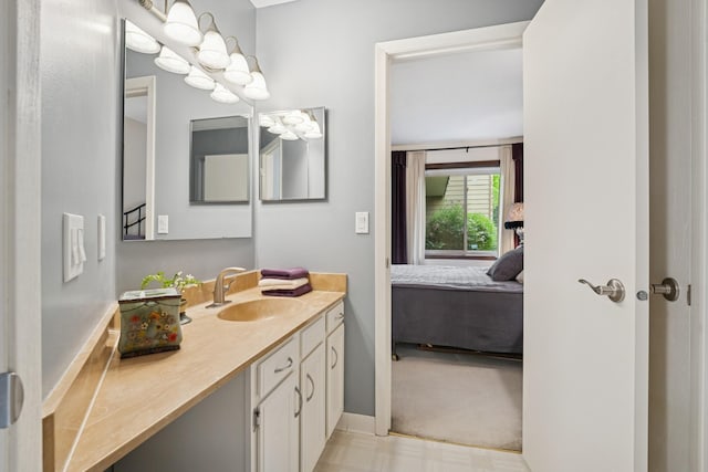 2250 Ridge Dr Unit 11, Saint Louis Park, MN 55416 - bathroom with connected bathroom, vanity, and baseboards