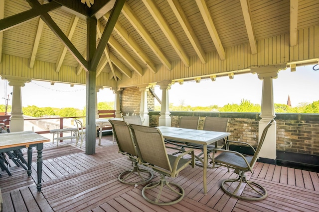 wooden deck with outdoor dining space