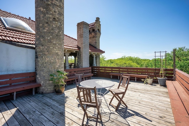 wooden deck with outdoor dining space