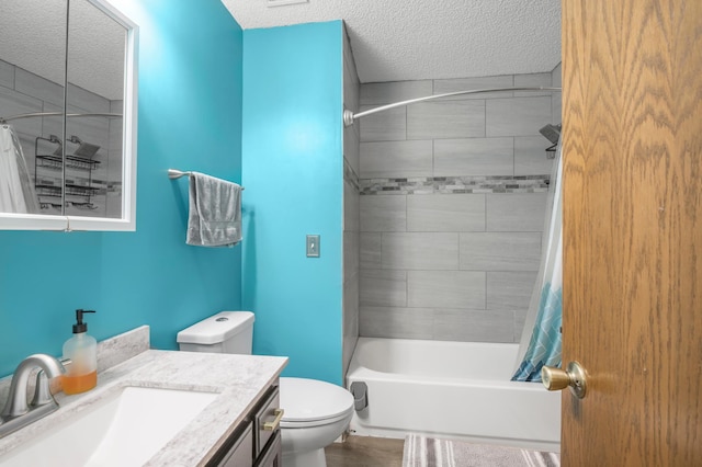 bathroom with a textured ceiling, toilet, vanity, and shower / bath combination with curtain