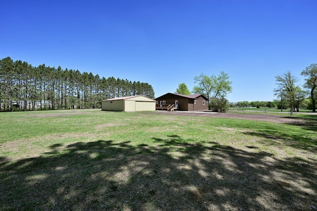 28257 French Rd, Danbury, WI 54830 - view of green lawn with an outbuilding