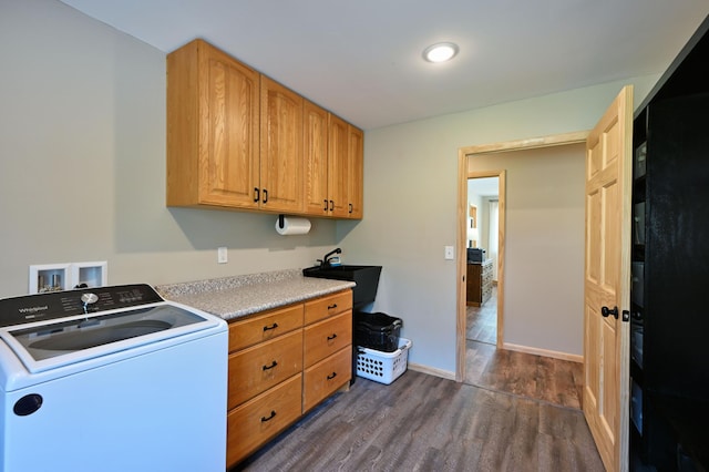 28257 French Rd, Danbury, WI 54830 - laundry room featuring washer / dryer, cabinet space, dark wood-style flooring, and baseboards