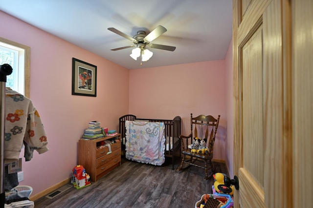 28257 French Rd, Danbury, WI 54830 - bedroom featuring dark wood-type flooring, baseboards, and ceiling fan