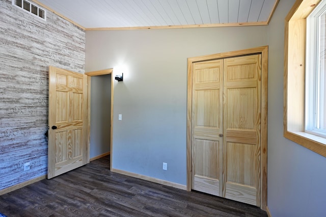 28257 French Rd, Danbury, WI 54830 - unfurnished bedroom featuring dark wood finished floors, baseboards, a closet, and wood ceiling
