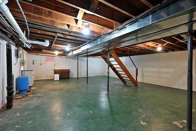 28257 French Rd, Danbury, WI 54830 - unfinished below grade area featuring a water pressure tank and stairs