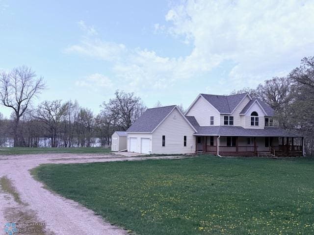 24129 County Road 144, Detroit Twp, MN 56501 - farmhouse inspired home featuring covered porch, dirt driveway, a front lawn, and an attached garage