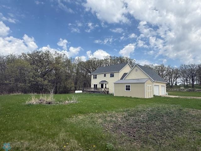 24129 County Road 144, Detroit Twp, MN 56501 - view of home's exterior featuring an attached garage and a lawn