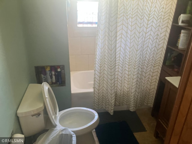 full bath with toilet and shower / bath combo