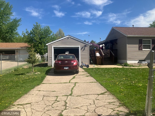 detached garage with concrete driveway